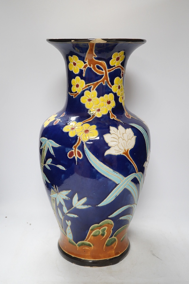 A South East Asian polychrome pottery vase and a Staffordshire pottery greyhound pen holder, vase 53cm high. Condition - vase fair, pen holder marks to glazing